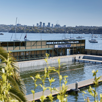 Aerial view of Dawn Fraser Baths with the city skyline